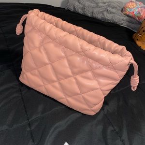 Pink clutch bag